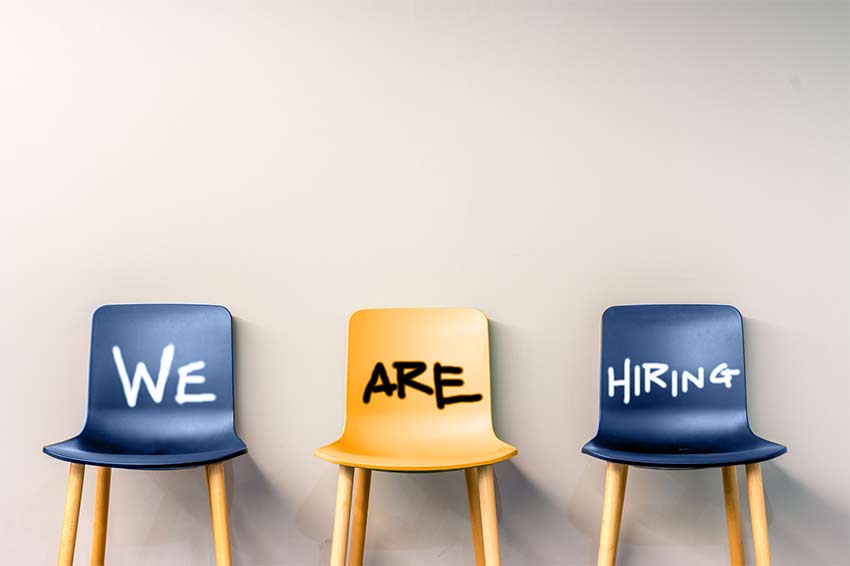 Three free chairs with the text 'we are hiring' written over them